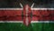 Kenya flag on cracked wall. Earthquake or drought concept