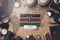 Kenya Flag Between Traveler`s Accessories on Old Vintage Map. Overhead Shot