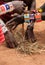 Kenya, Tsavo East - masai people setting the fire by their hands