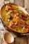 Kenyan chicken in coconut curry sauce Kuku Paka Recipe closeup. Vertical