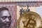 Kenyan fifty shilling bank note with a gold bitcoin