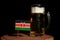 Kenyan flag with beer mug isolated on black