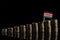 Kenyan flag with lot of coins isolated on black