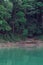 Kenyir lake water with tropical forest trees. Beautiful tranquill idylic view