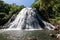 Kepirohi waterfall in the jungle with palm trees around, near Nan Madol, Pohnpei island, Federated states of Micronesia.