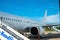 Kerkyra, Greece - 09 29 2022: View in Corfu Airport On White Aircraft Tail of Boeing in Sunny Weather. Plane Is Ready For Boarding