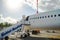 Kerkyra, Greece - 09 29 2022: View in Corfu Airport On White Nose of Boeing in Sunny Weather. Plane Is Ready For Boarding