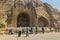 KERMANSHAH, IRAN - JULY 11, 2019: People observe reliefs at Taq-e Bostan in Kermanshah, Ir