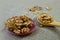 Kernel walnuts in a bowl and wooden spoon on sackcloth