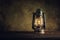 Kerosene lamp oil lantern burning with glow soft light on aged w