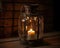 Kerosene oil lamp burning with soft light glow on aged wooden table. Old fashioned vintage kerosene oil lantern lamp.