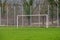 Kessel-Lo, Flemish Brabant, Belgium - Empty green field and goal of an amateur soccer field