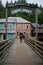 Ketchikan, Alaska: A couple crosses a footbridge to enter Creek Street