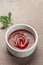 Ketchup in bowl. Portion of tomato sauce. vertical image. top view. place for text