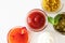 Ketchup, sweet chili sauce, pesto, french mustard and mayonnaise in glass bowls on a white background, top view. Various seasoning