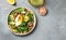 Keto diet plate quinoa, avocado, egg, tomatoes, spinach and sunflower seeds on light background. Healthy food, ketogenic diet,
