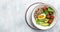 Keto diet plate quinoa, avocado, egg, tomatoes, spinach and sunflower seeds on light background. Healthy food, ketogenic diet,