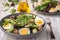 Keto dish - healthy green salad with arugula, tuna, mozzarella and eggs.