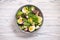 Keto dish - healthy green salad with arugula, tuna, mozzarella and eggs.