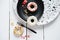 keto donuts with glaze and sprinkles of sublimated strawberry. low carb ketogenic meal. sugarless doughnuts with various