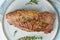 Keto ketogenic diet beef steak, striploin on gray plate on white background. Paleo food recipe with whole big piece of meat and