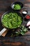 keto mushy peas ingredients in frying pan and peas in bowl with mint shallot pepper and salt top view over old pub wood table