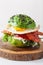 Keto paleo diet avocado breakfast burger with bacon, egg, tomato