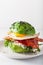 Keto paleo diet avocado breakfast burger with bacon, egg, tomato