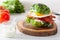 Keto paleo diet avocado breakfast burger with bacon, egg, tomato