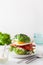 Keto paleo diet avocado breakfast burger with bacon, egg, tomato