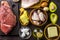 Ketogenic diet food. Balanced low-carb food background. Fish, meat, cheese, nuts on a dark background. Healthy balanced food with