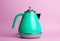 Kettle Background. Electric vintage retro kettle on a colored pink background. Lifestyle and design concept