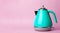 Kettle Background. Electric vintage retro kettle on a colored pink background. Lifestyle and design concept