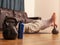 Kettle bell in focus, man doing push up on a kettle bell at home in living room. Concept work out and keeping fit