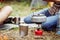 Kettle boiling on a gas stove in the camping