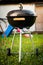 Kettle Charcoal BBQ Barbecue Grill in garden or backyard.