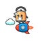 Kettle mascot character riding a rocket