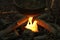 A kettle pot over a campfire.