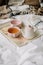 Kettle with tea and cups on a tray. Breakfast at home in bed, coziness