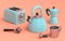 Kettle, toaster, coffee machine horn and geyser coffee maker on coral background