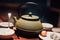 kettle and two small bowls on wooden table