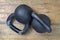 Kettlebell black on wooden background