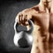 Kettlebell dumbbell - fitness man lifting weight