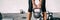 Kettlebell weightlifting woman lifting free weight panoramic banner gym. Hands holding heavy kettle bell for strength