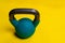 For Kettlebell yellow background Blue with space on a text space iron, for cast lifting in equipment from heavy