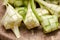 Ketupat casing and rice in bamboo container.