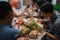 Ketupat with people eating on the background