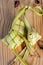 Ketupat Pouches on Wooden Background - Ketupat is a type of dumpling made from rice packed inside a diamond-shaped container of