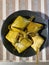Ketupat are rice - based snacks wrapped in woven young coconut leaves or some use palm leaves