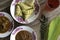 Ketupat rice dumpling served with red syrup,meat curry and peanut sause is a popular or signature dish made from rice packed. It